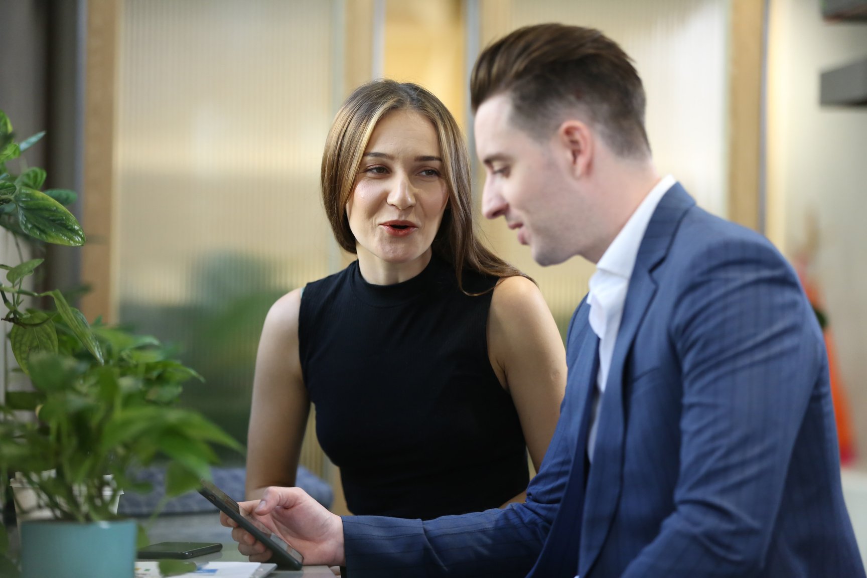 Woman Coworker Speaking with Man Coworker